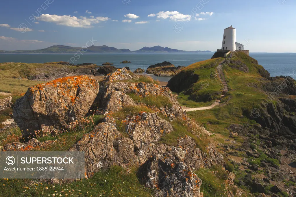 UK - Wales, Anglesey, Llanddwyn Island, Twr mawr lighthouse with menai strait and lleyn peninsula in distance