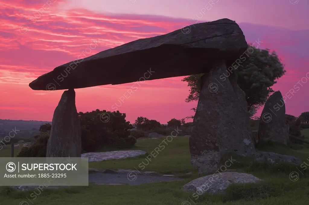 UK - Wales, Pembrokshire, Newport, Pentre Ifan at Dawn undoubtedly one of the finest megalithic burial chambers or Quiot or Cromlec in Britain. It stands on a slope overlooking vast tracts of the  Pembrokeshire  National Park and Cardiganshire bay. It is situated nr Newport in Pembrokeshire and consists of a 16 ton capstone and is supported by three spindly uprights and is thought to be 5000 years old.