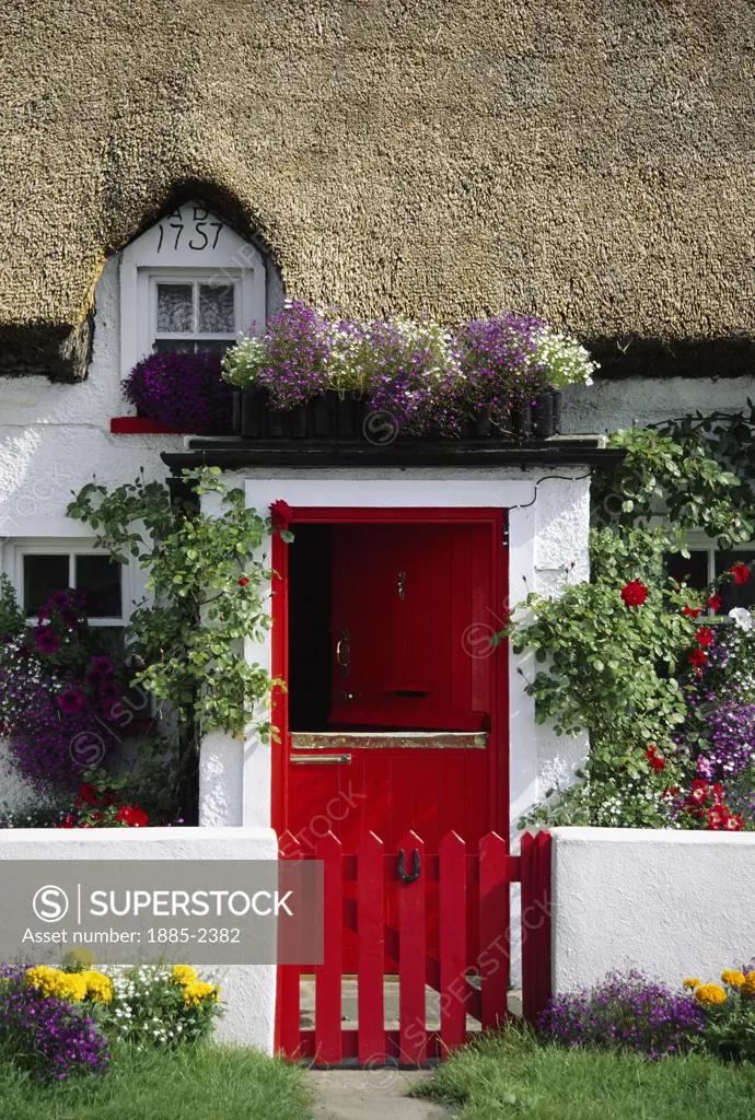 Ireland, County Waterford, General, Thatched Cottage with red door and gate