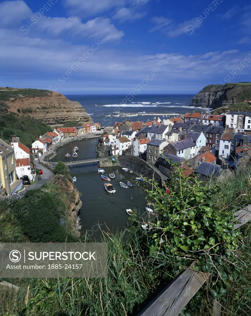 UK - England, Yorkshire, Staithes, View over village and harbour from clifftop