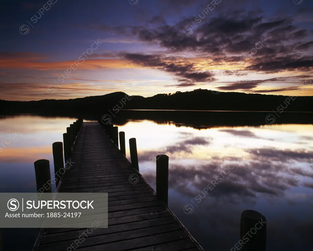 UK - England, Cumbria, Coniston, Sunset over jetty on Coniston Water