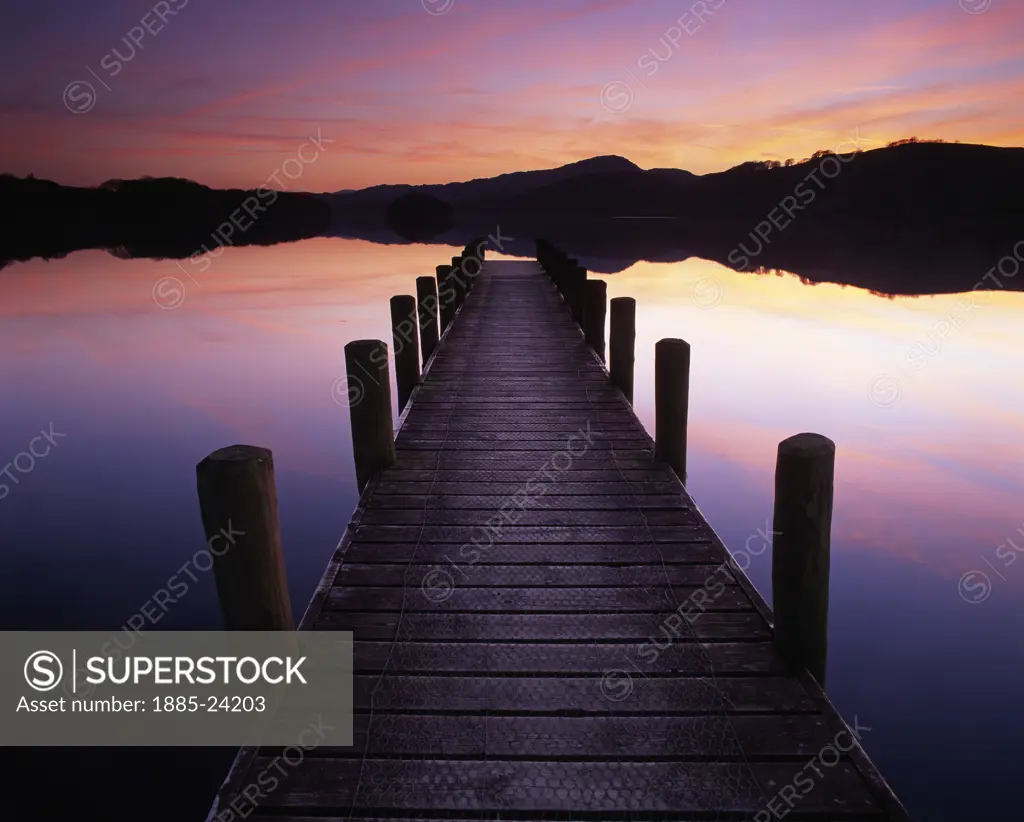UK - England, Cumbria, Coniston, Sunset on Coniston Water from Rigg Wood jetty