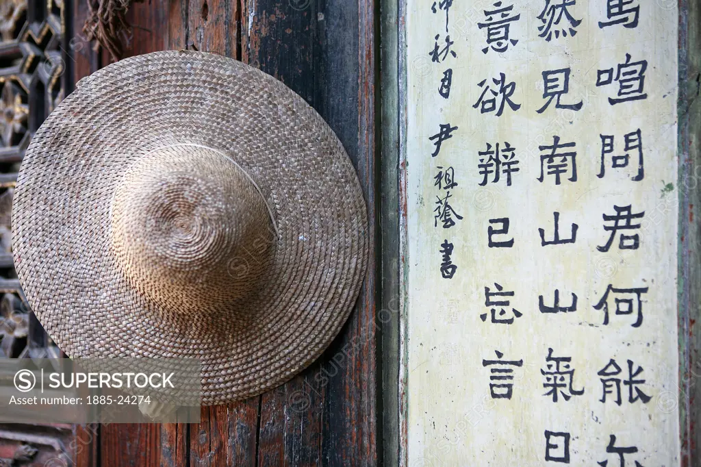 China, Jianshui - near, Conical hat on wall at Tuanshan village