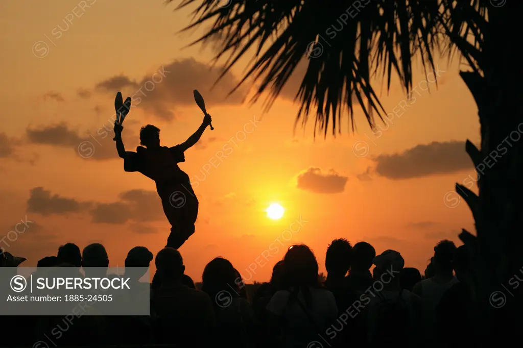 USA, Florida, Key West, Street performer at sunset