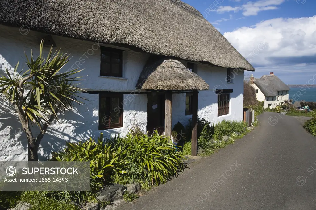 UK - England, Cornwall, Church Cove, Thatched cottages and sea