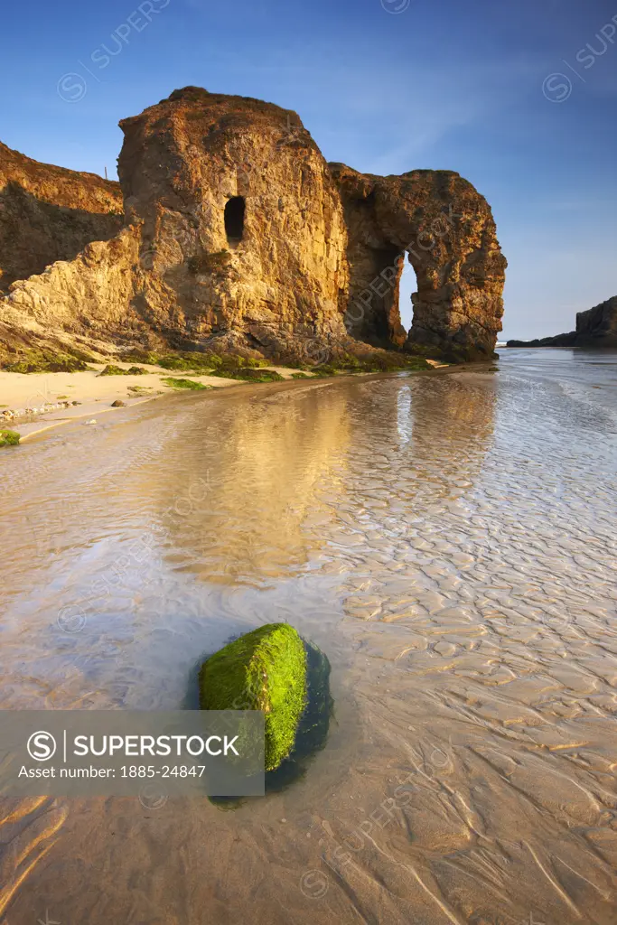UK - England, Cornwall, Perranporth, Beach scene with natural rock arch