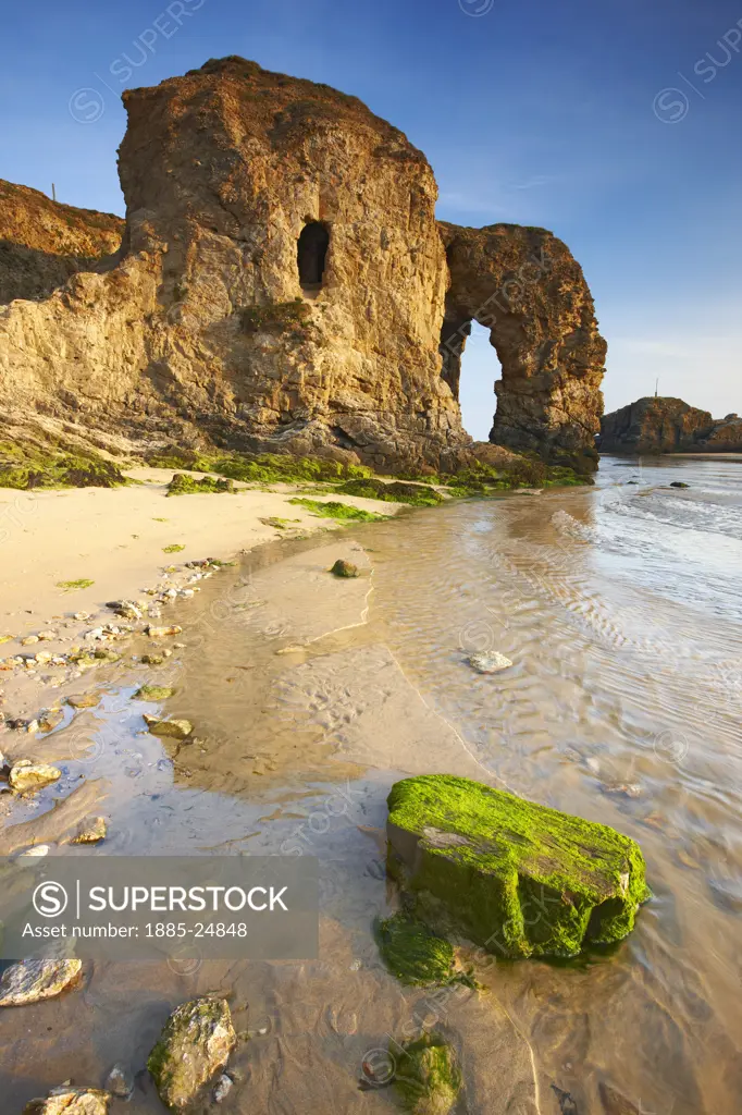 UK - England, Cornwall, Perranporth, Beach scene with natural rock arch