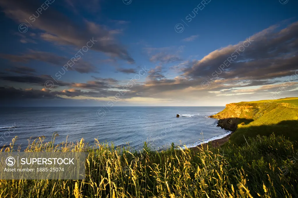 UK - England, Yorkshire, Saltwick Bay, View over bay at sunset