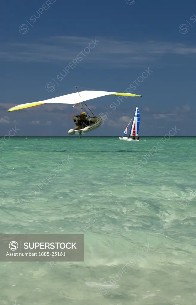 Caribbean, Cuba, Varadero, Microlight flying boat  and Hobie Cat at Varadero Beach