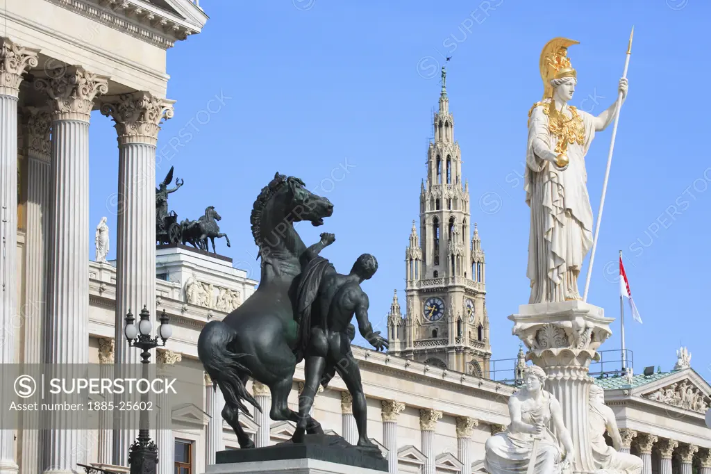 Austria, Vienna, Parliament  with statues and Rathaus - City Hall