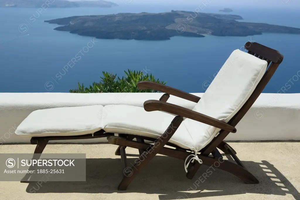 Greek Islands, Santorini Island, Firostefani, Lounger overlooking the Caldera