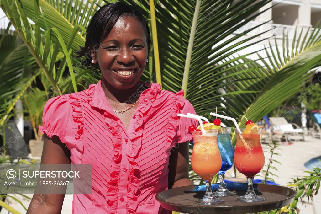 Caribbean, Barbados, St Michael, Local lady and colourful cocktails