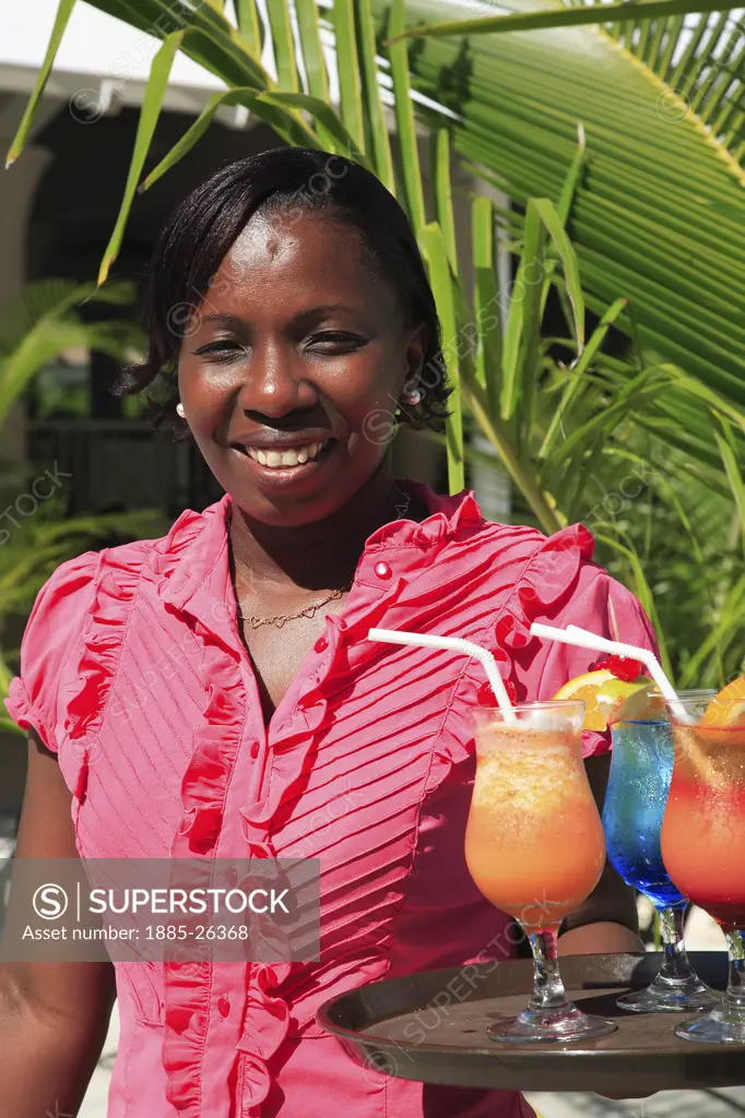 Caribbean, Barbados, St Michael, Local lady and colourful cocktails