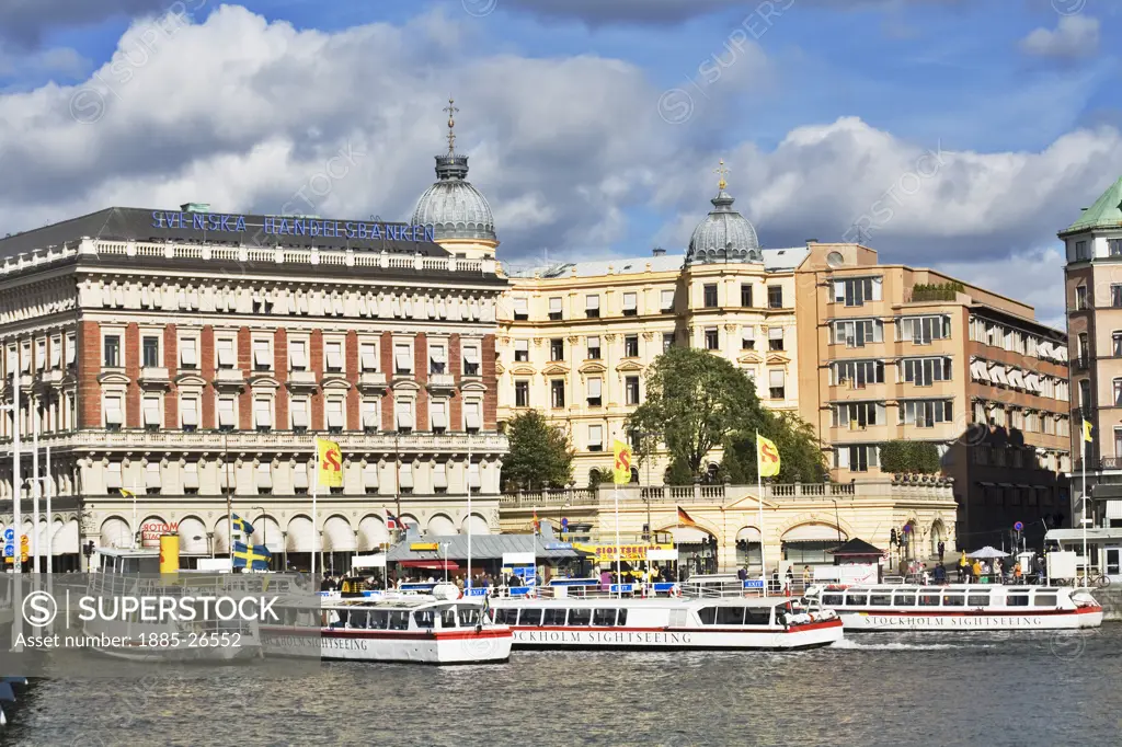 Sweden, Stockholm, Kungstradgardsgatan and sightseeing boats
