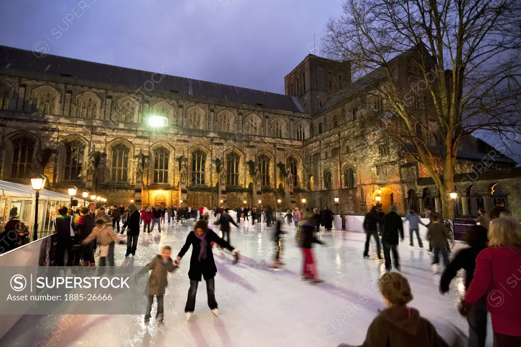 UK - England, Hampshire, Winchester, Christmas Ice Skating Rink outside Winchester Cathedral