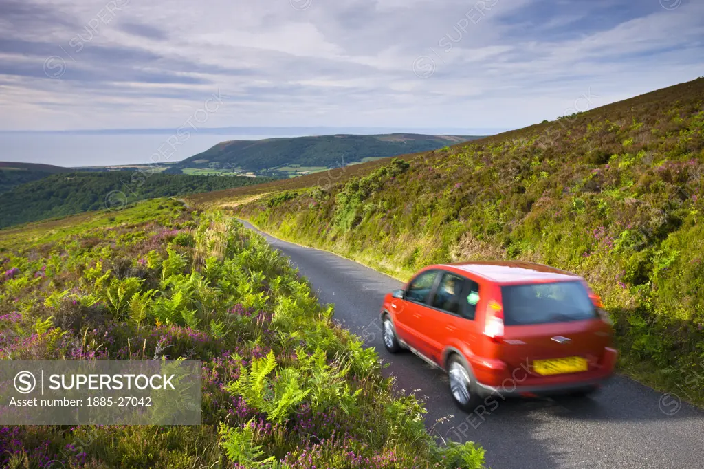 UK - England, Devon, Exmoor , Car driving down Dunkery Hill