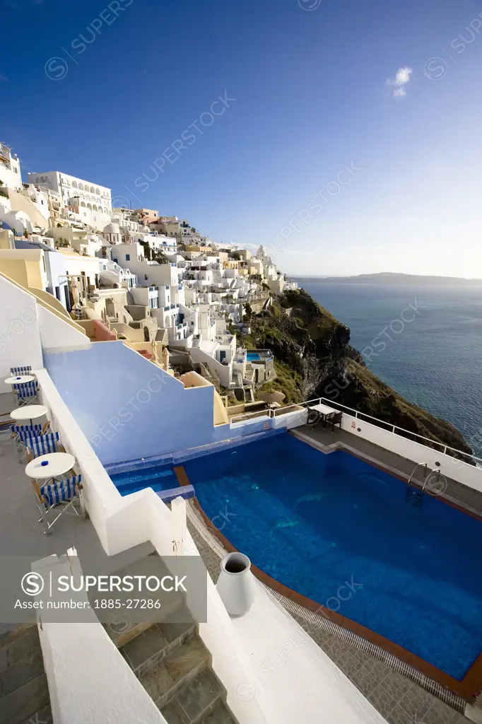 Greek Islands, Santorini Island, Fira, View of town and sea with swimming pool