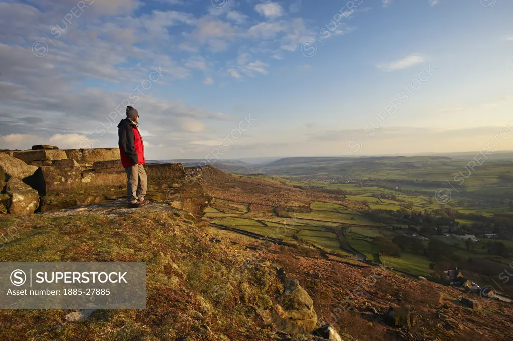 UK - England, Derbyshire, Peak District National Park, Hiker at Curbar Edge