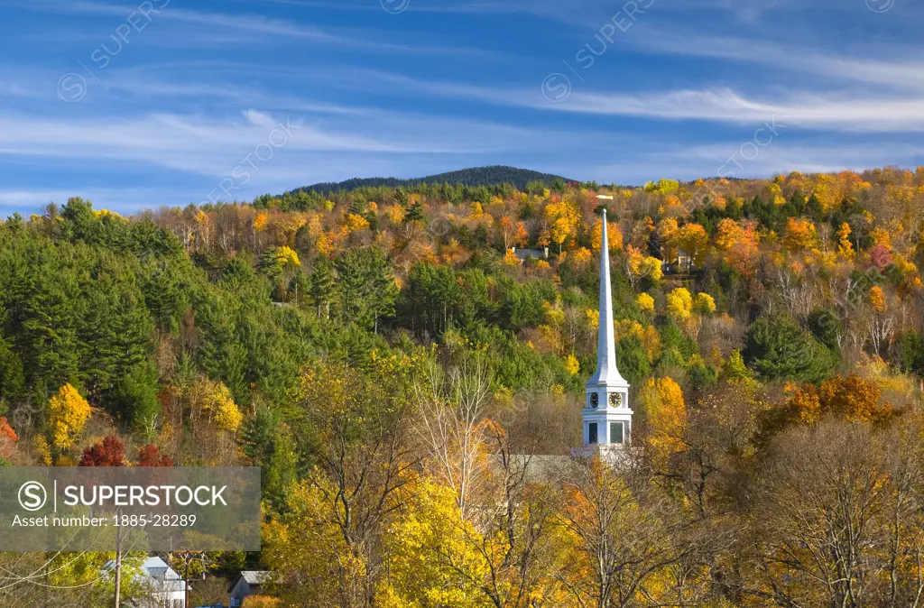 USA, Vermont, Stowe, View to chapel over autumn treeline