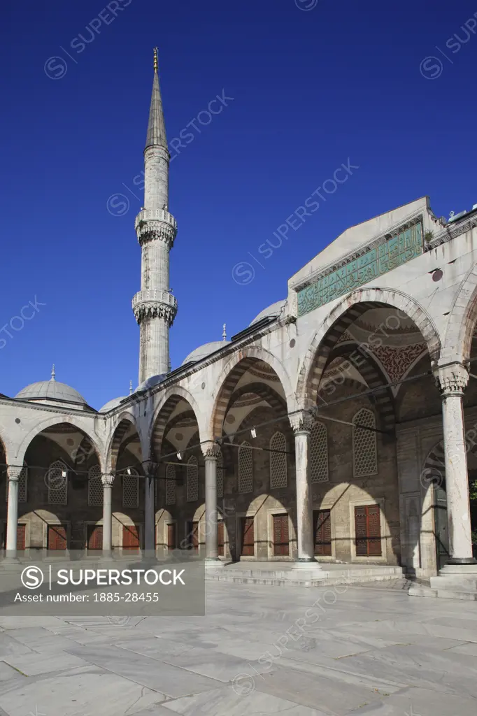 Turkey, Istanbul, Blue Mosque - domes and minaret from courtyard