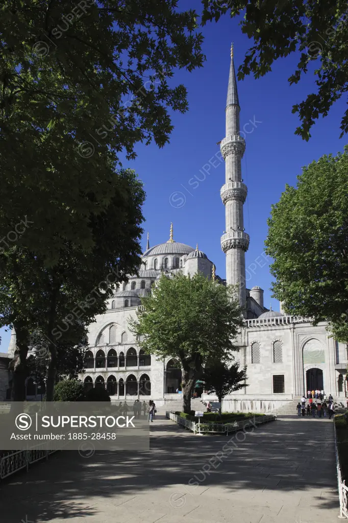 Turkey, Istanbul, Blue Mosque - domes and minaret from courtyard
