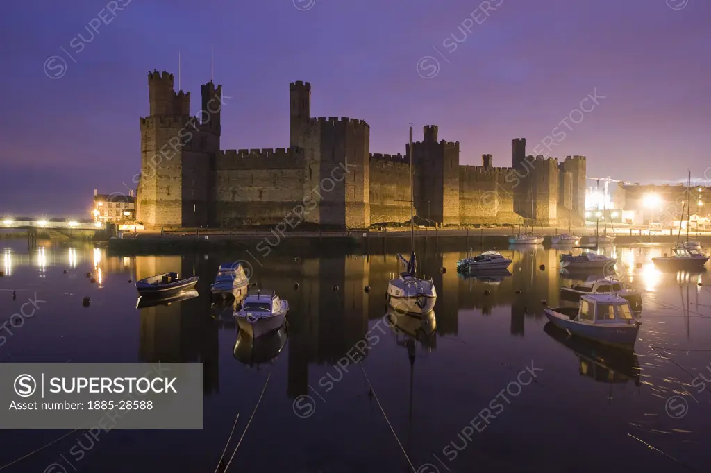 UK - Wales, Gwynedd, Caernarfon, Caernarfon Castle at dawn