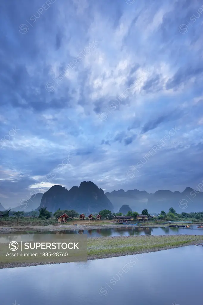 Laos, Vientiane, Vang Vieng, dawn over the mountains and Nam Song River at Vang Vieng, Laos