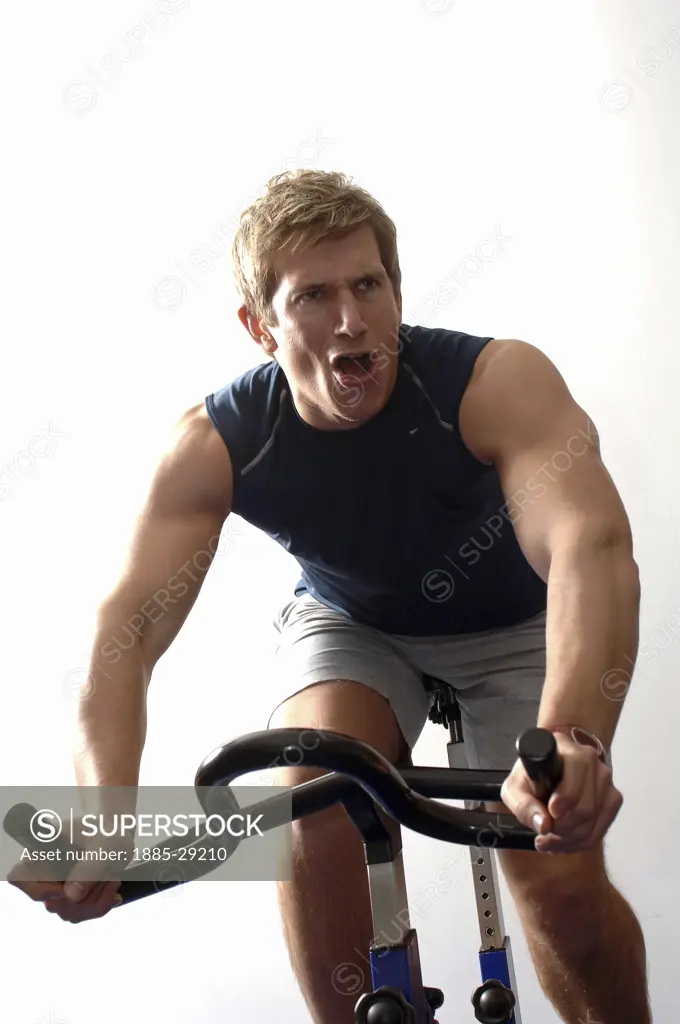 Leisure & Activities, General, Man on studio bike shouting encouragement