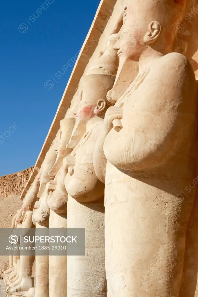 Egypt, Luxor -near, Statues along wall at Temple of Queen Hatshepsut