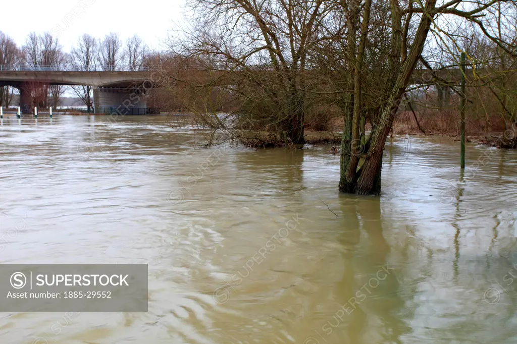View of the Flooded river Nene at Orton Mere lockgate sluices, Peterborough, Cambridgeshire, England, UK