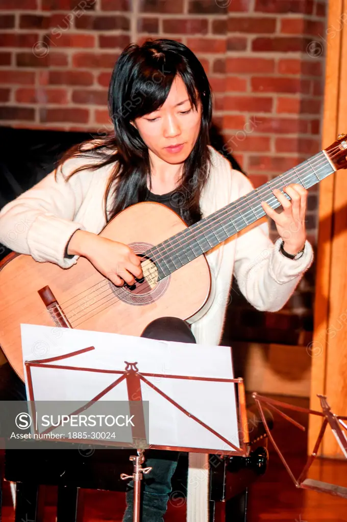 Xuefei Yang playing guitar during rehearsals at the Turner Sims Concert Hall in Southampton, Hampshire, England