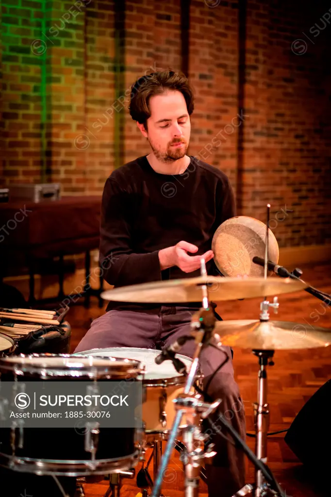 John Parker playing drums at the sound check with the group Trichotomy whilst performing at the Turner Sims Concert Hall in Southampton, England
