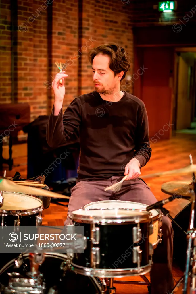 John Parker playing drums at the sound check with the group Trichotomy whilst performing at the Turner Sims Concert Hall in Southampton, England