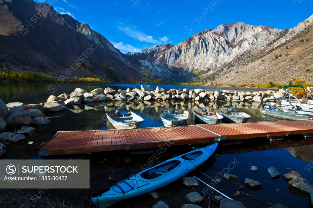 Fishing Boats Docked  on Convict Lake With Mount Morrison and Laurel Mountain in the Distance, Mammoth Lakes, California, USA