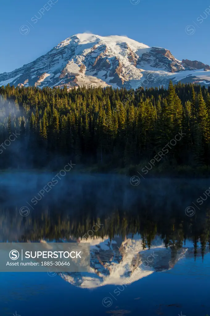 Mount Rainier in Washington state is reflected in appropriately named Reflection Lakes. Part of the larger and active volcanic range known as the Cascade Mountains, the peak is the highest in the state with 25 major glaciers clinging to its flanks.