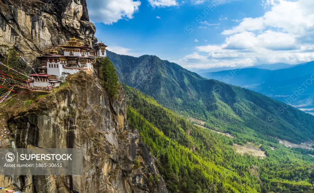 Perched hundreds of feet above the valley below, Taktsang Monastery is steeped in legend and lore of the Guru Rinpoche's time spent here meditating in the 8th century. The structure is built into and of the rock with the only flat sections being those of wooden temple floors and the few dorm rooms for monks.