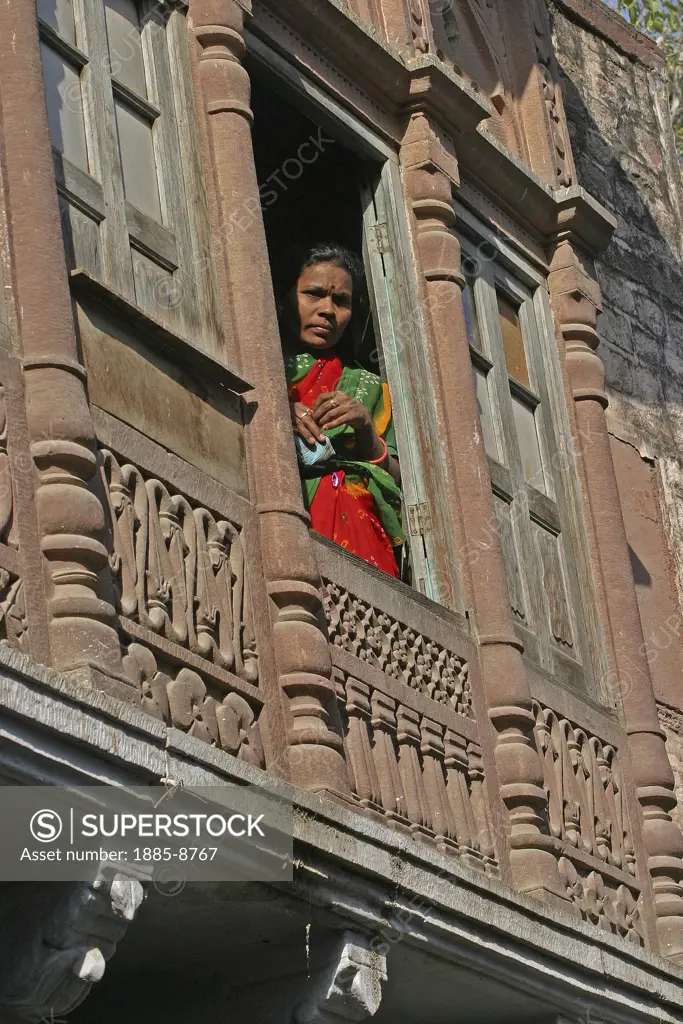 India, Rajasthan, Jodhpur, Woman at window of a Haveli - merchants house