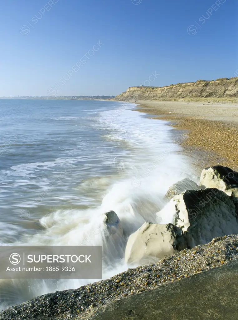 UK - England, Dorset, Hengistbury Head, View of beach with waves breaking over breakwater