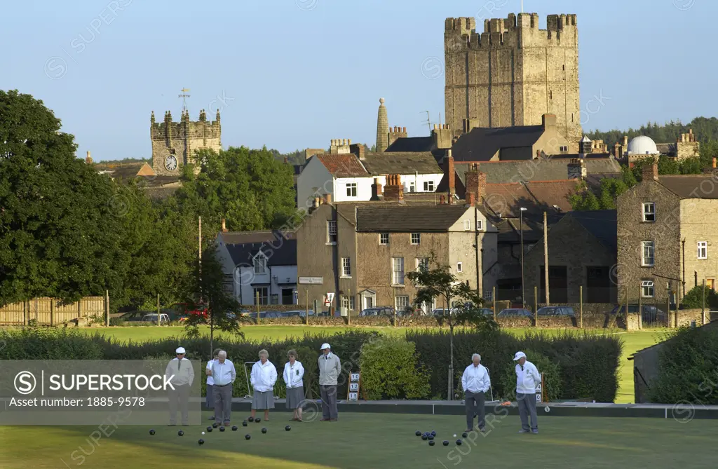 UK - England, Yorkshire, Richmond, Bowls match in progress with town and castle in background