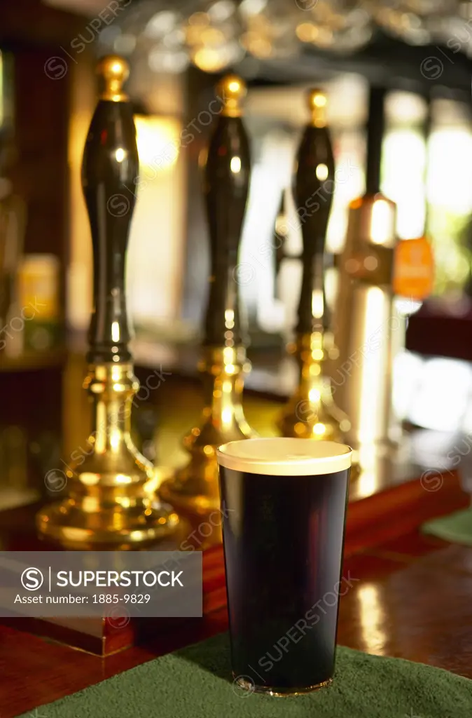 Ireland, Food & Drink, Beer, Glass of Irish stout beer on pub bar counter