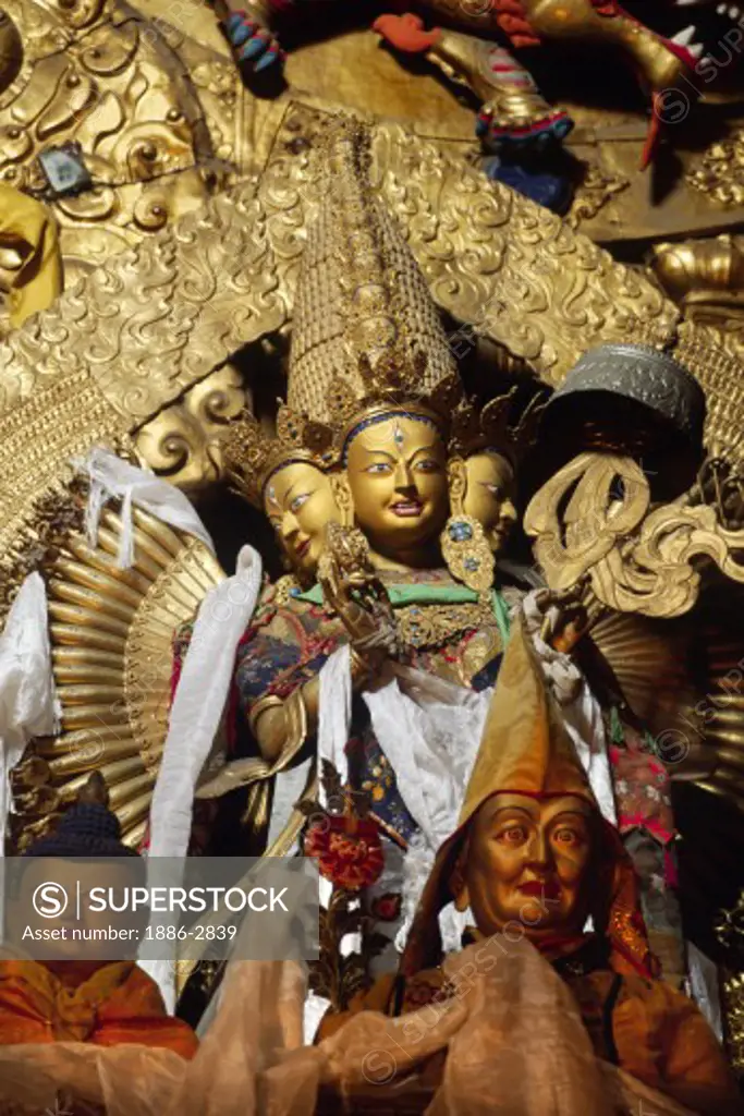 Wrathful form of AVALOKITESVARA sits below Maitreya Statue in the MAIN ASSEMBLY HALL at DREPUNG MONASTERY - LHASA, TIBET