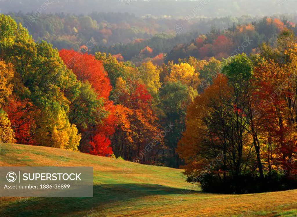 Autumn in the mixed hardwoods forest, hills and mowed hay meadows of the Cuyahoga National Recreation Area, Ohio, USA.