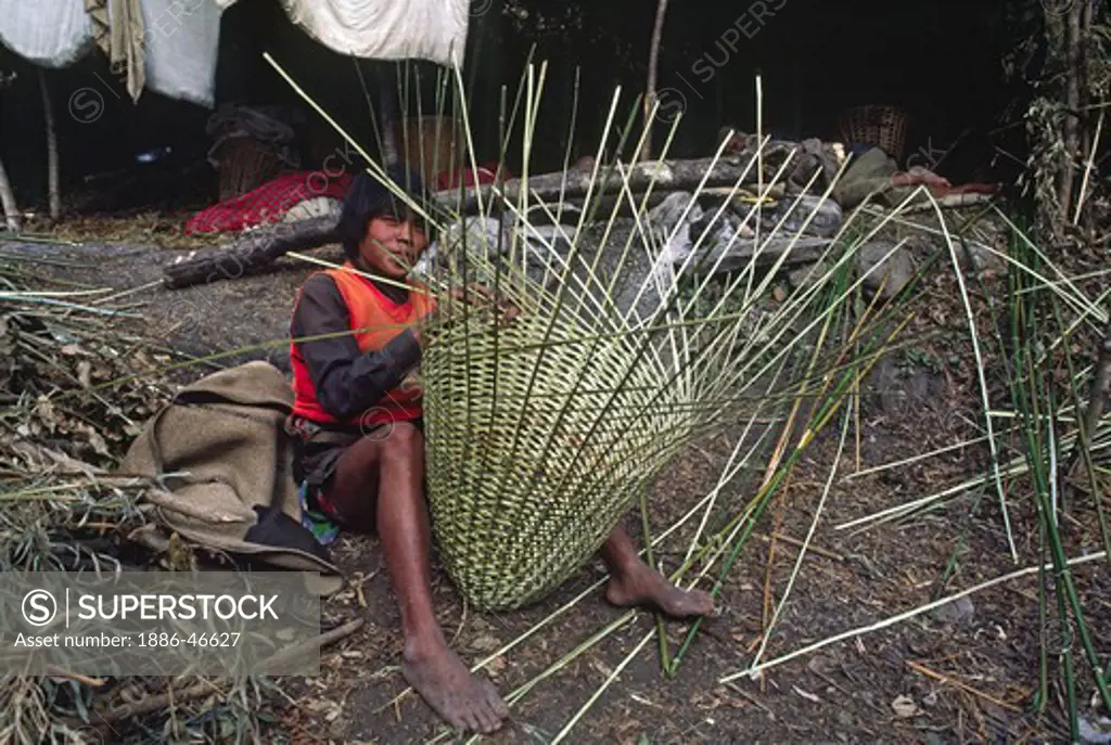 Young man makes a dolko (basket) in the GANESH HIMAL - NEPAL