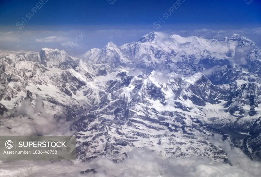 ARIAL view of the HIMALAYAS covered in snow - flight between KATMANDU, NEPAL & LHASA, TIBET