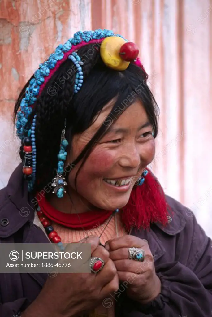TURQUOISE, CORAL & AMBER decorate this TIBETAN WOMANS hair - LHASA, TIBET