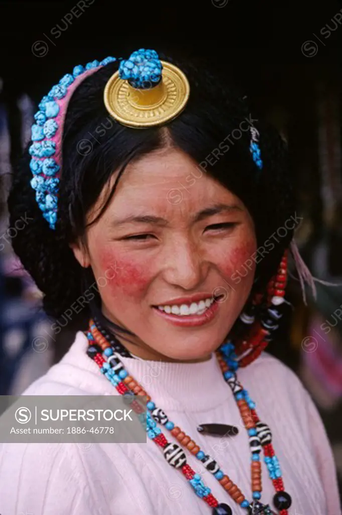 A TIBETAN BEAUTY wears TURQUOISE, CORAL, Z-STONES  & A GOLD & CORAL HAIR PIECE - LHASA, TIBET