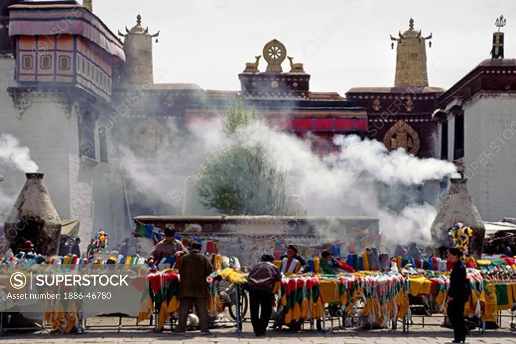 Incense burns in front of the JOKHANG, the holiest temple in TIBET, built in the 7th Century by KING SONGTSEN GAMPO - LHASA, TIBET