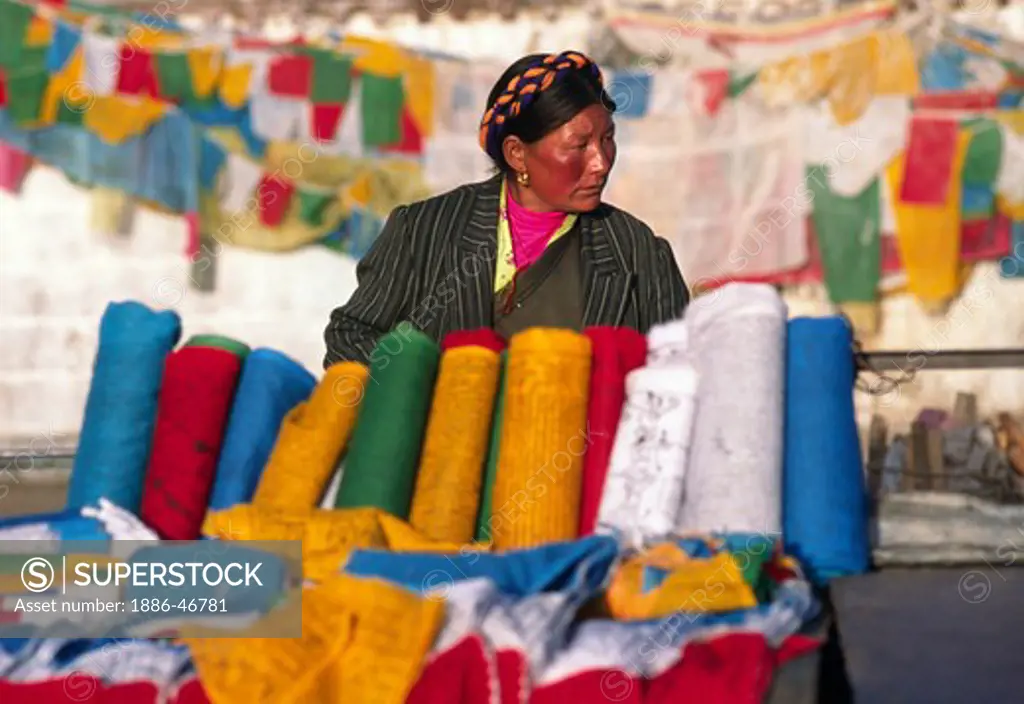 PRAYER FLAGS are sold in front of the JOKHANG, TIBET'S holiest temple,  - LHASA, TIBET