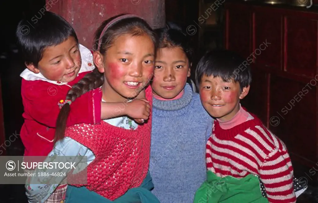 Young TIBETANS visit the MAIN HALL of SERA JE COLLEGE - SERA MONASTERY, TIBET