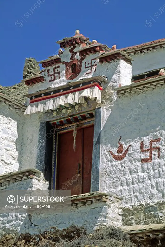 REVERSE SWASTIKA & SUN & MOON decorate a doorway in the village of GONGGAR - CENTRAL TIBET